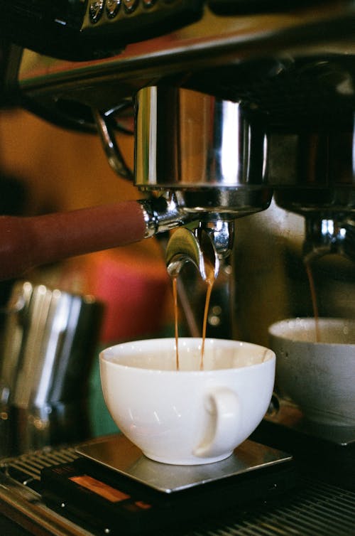 Free White Ceramic Cup on Silver Espresso Machine Stock Photo