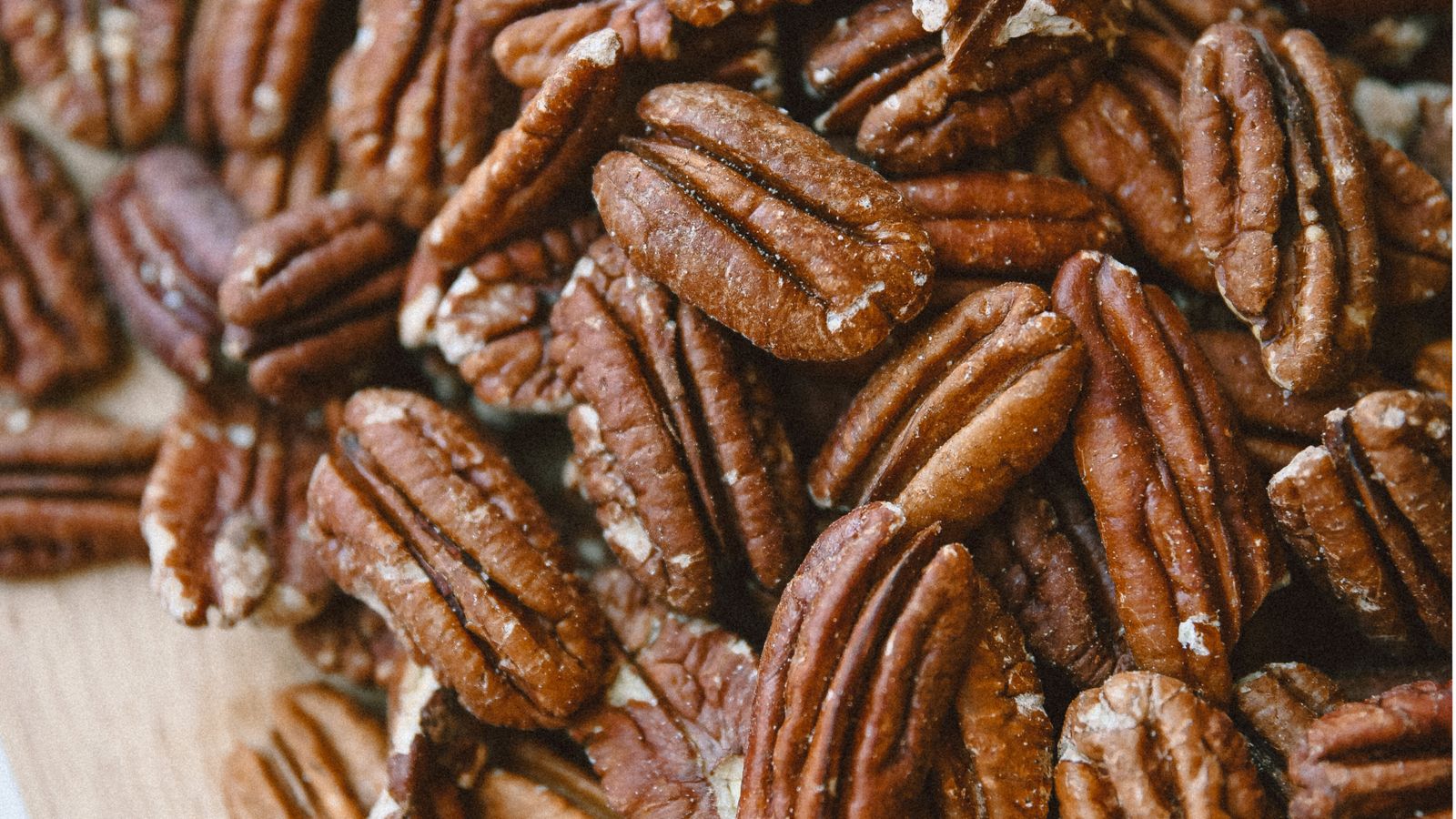 Pecan nuts on a wooden board — photo by Oks Malkova on Pexels Pecan nuts on a wooden board