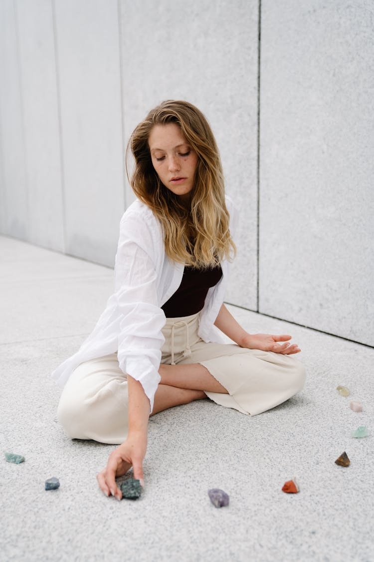 Woman Putting Stones Around Her