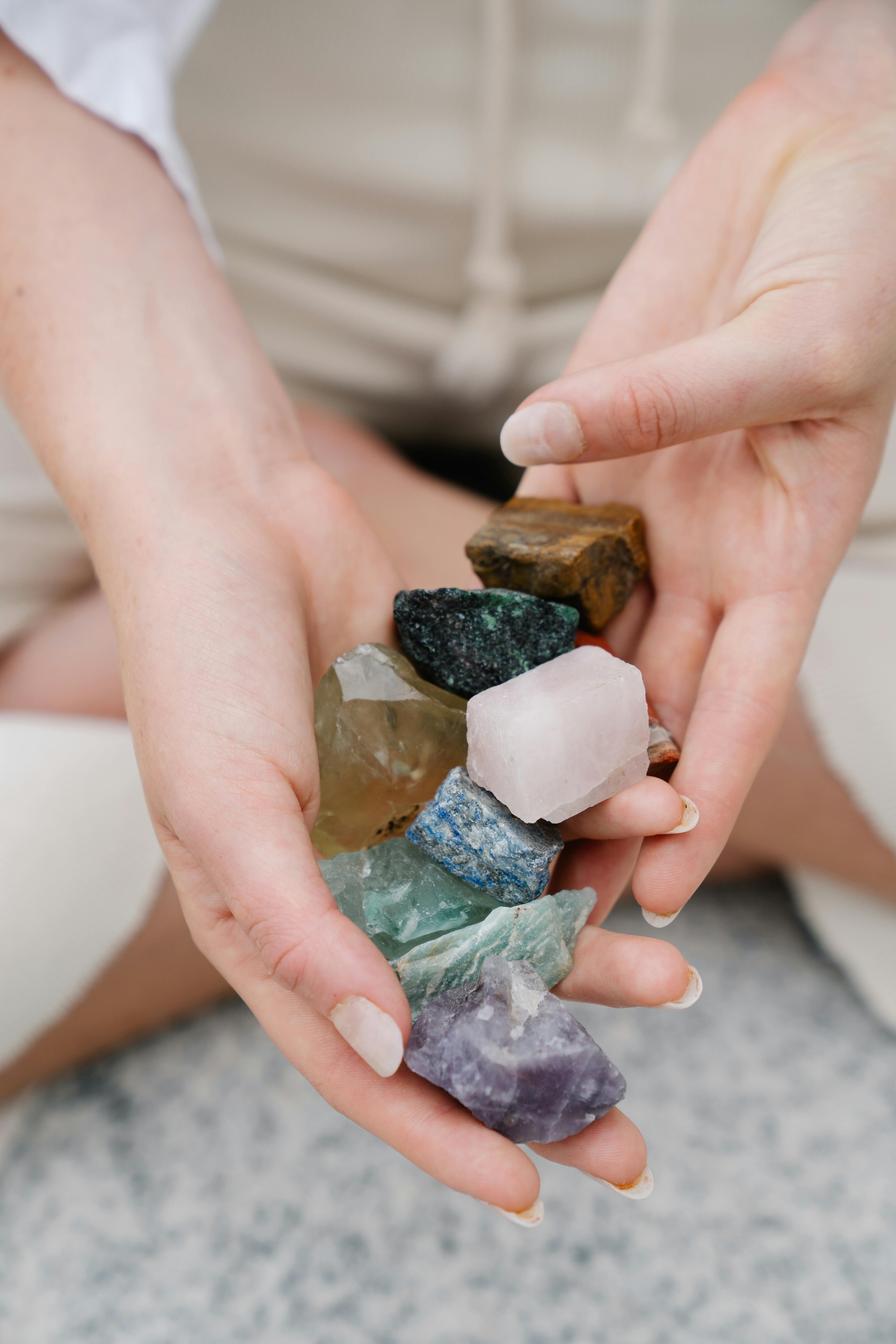 close up of holding different stones