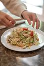 Person Holding White Ceramic Plate With Food