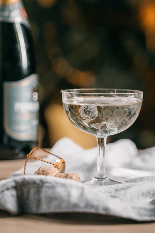 Clear Glass with Wine on White Textile