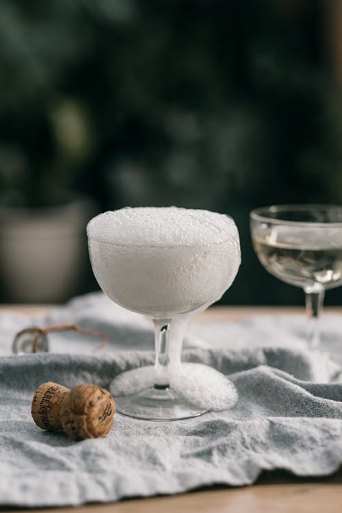 Free White Bubble Overflowing on Clear Wine Glass Stock Photo