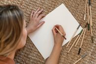 Person Holding White Printer Paper