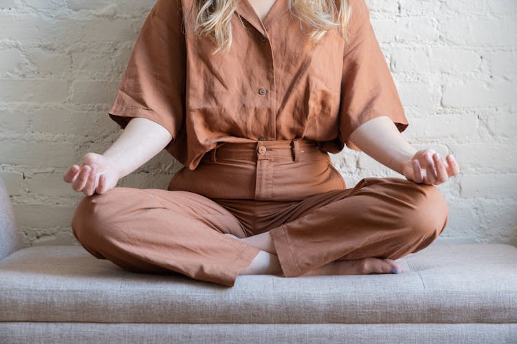 Close-up Photo Of A Person Meditating