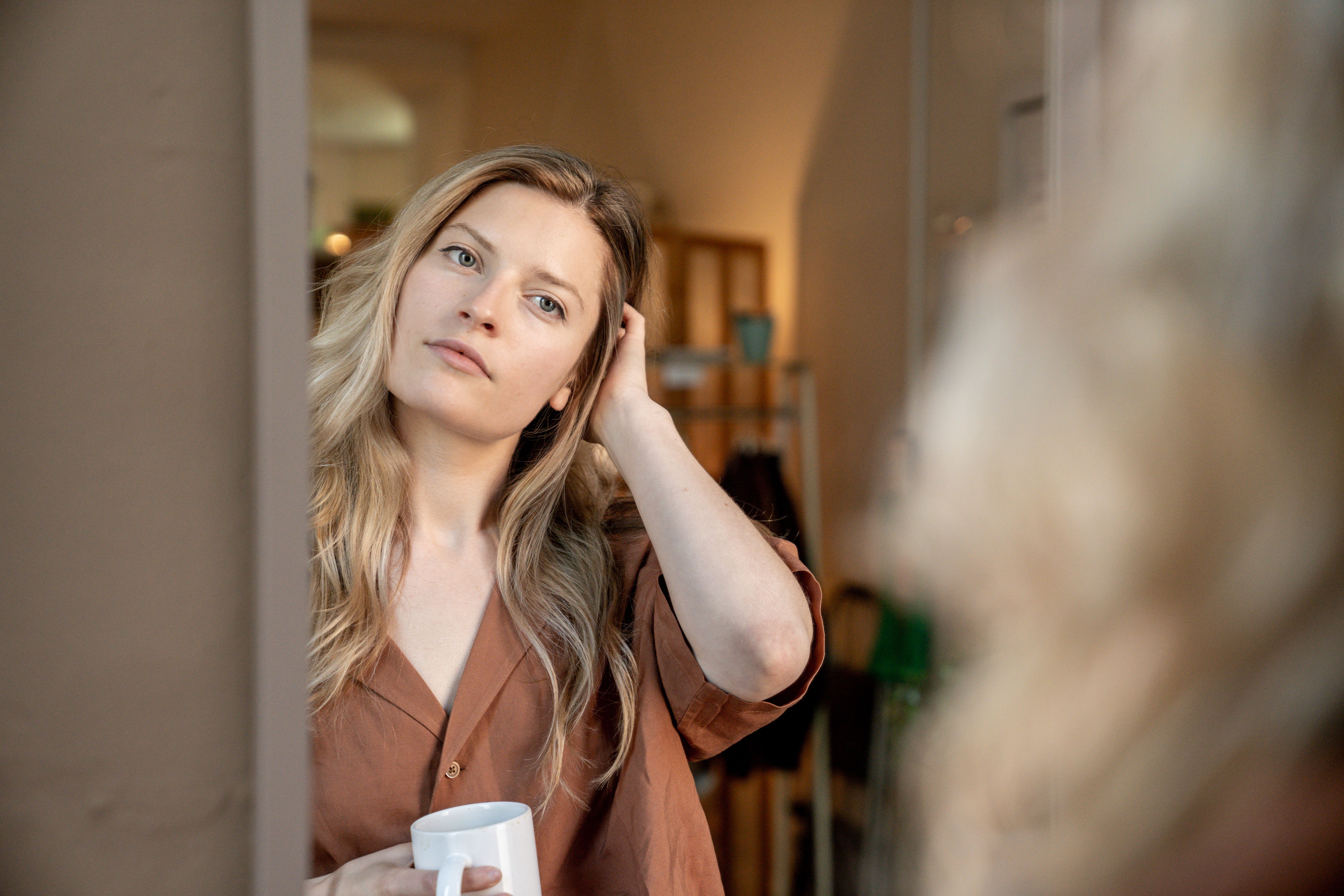 woman looking in mirror self reflection