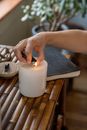 Person Holding White Pillar Candle