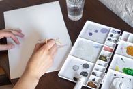 Person Painting on White Canvas