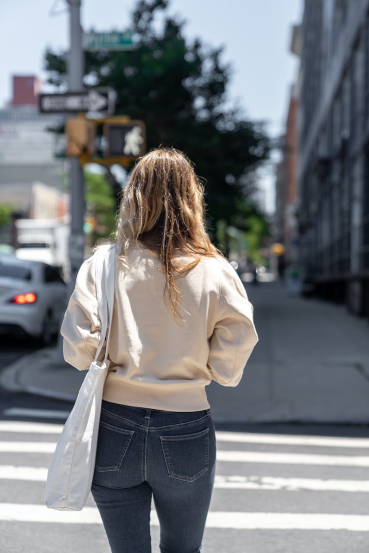 A Woman Crossing The Street