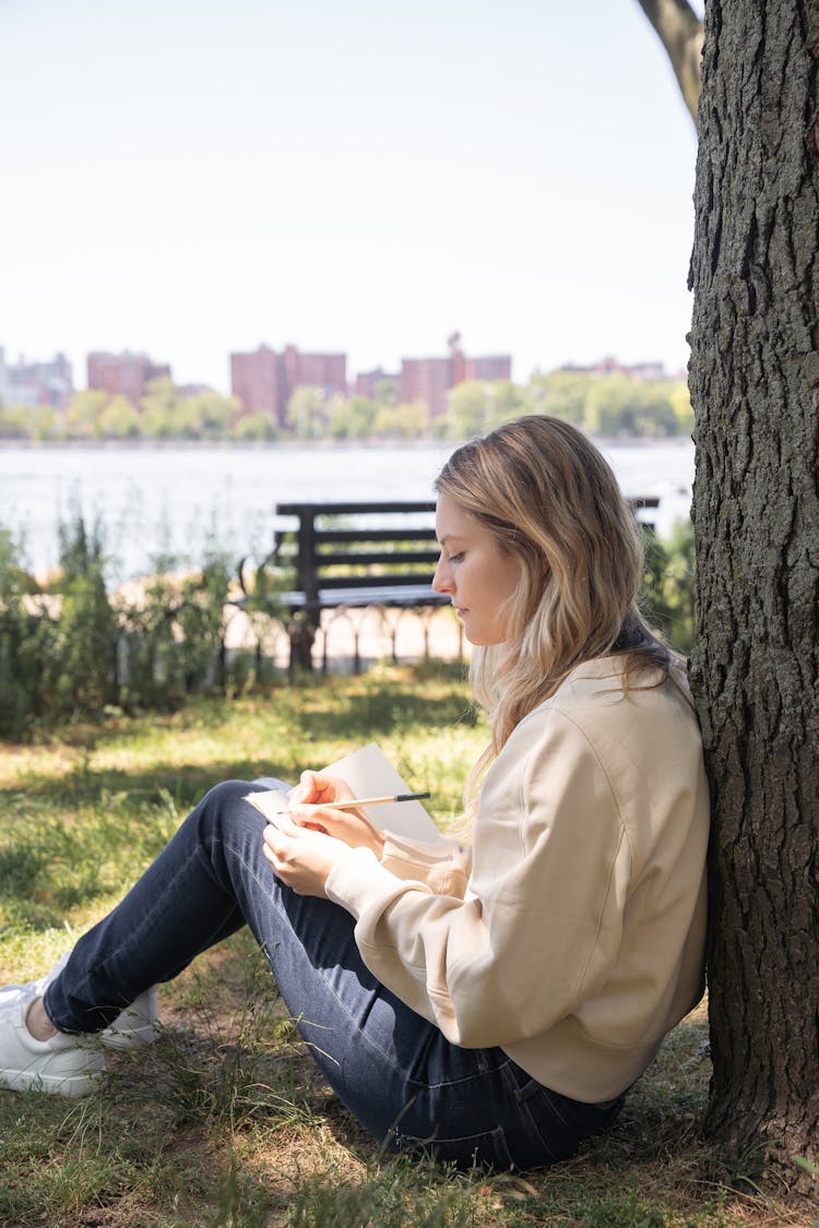 Woman Sitting With Notebook