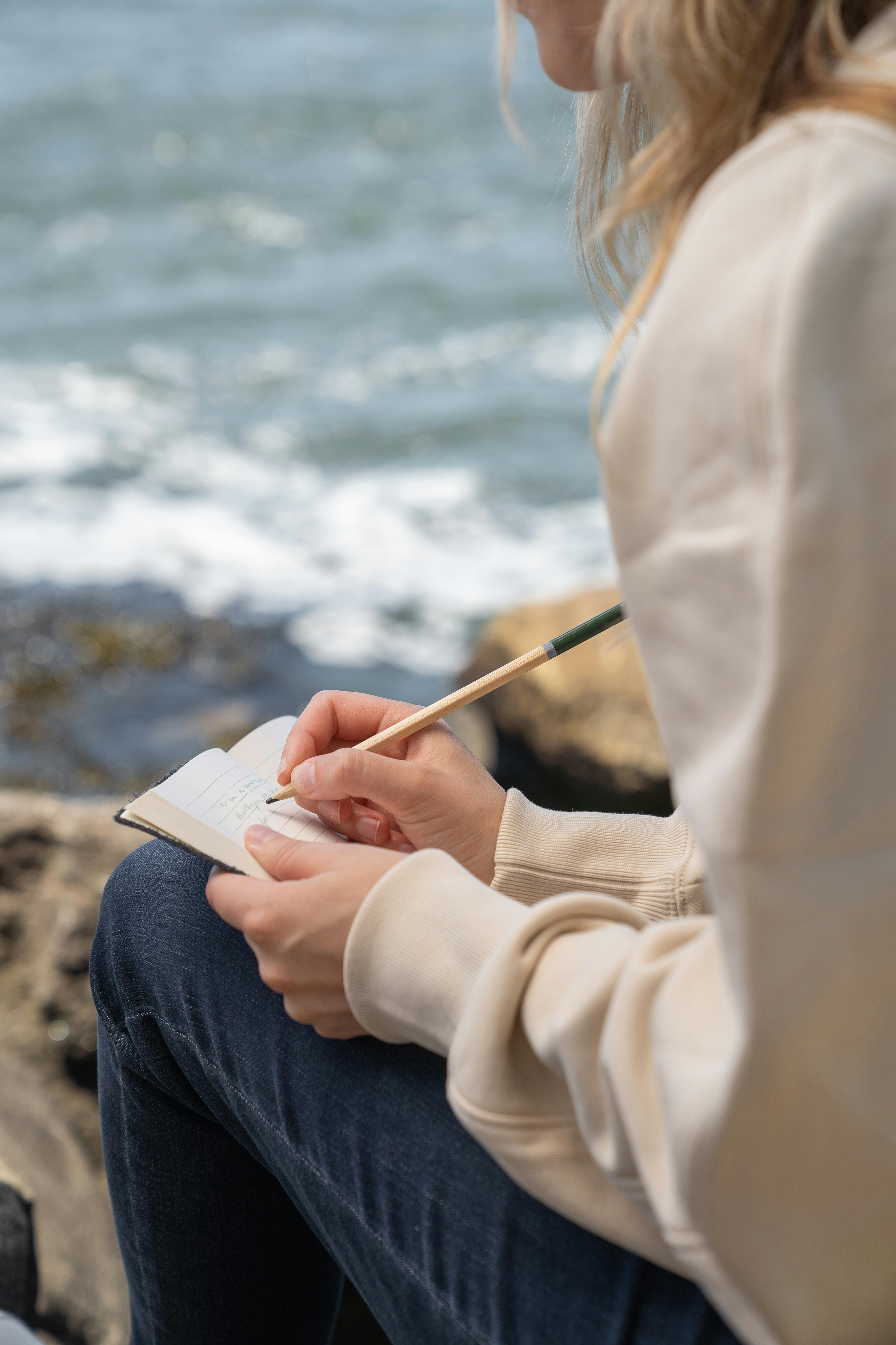 Closeup Photo of Journal Book and Pencils · Free Stock Photo