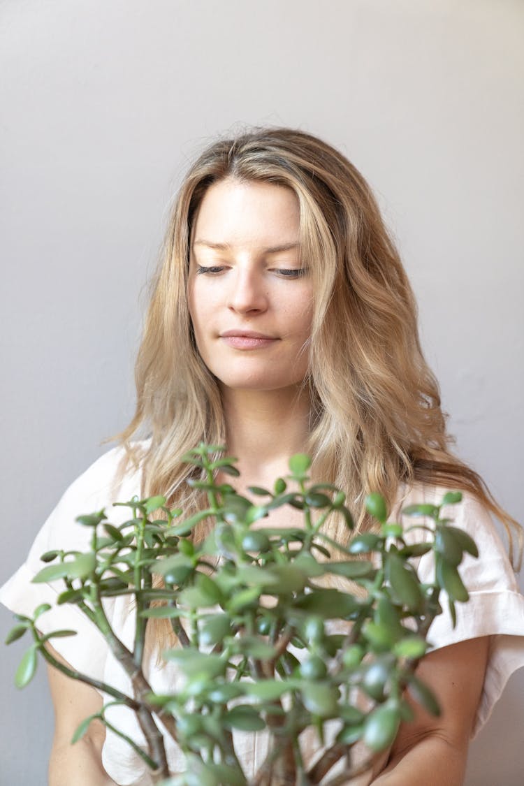 Woman Holding A Crassula Plant 