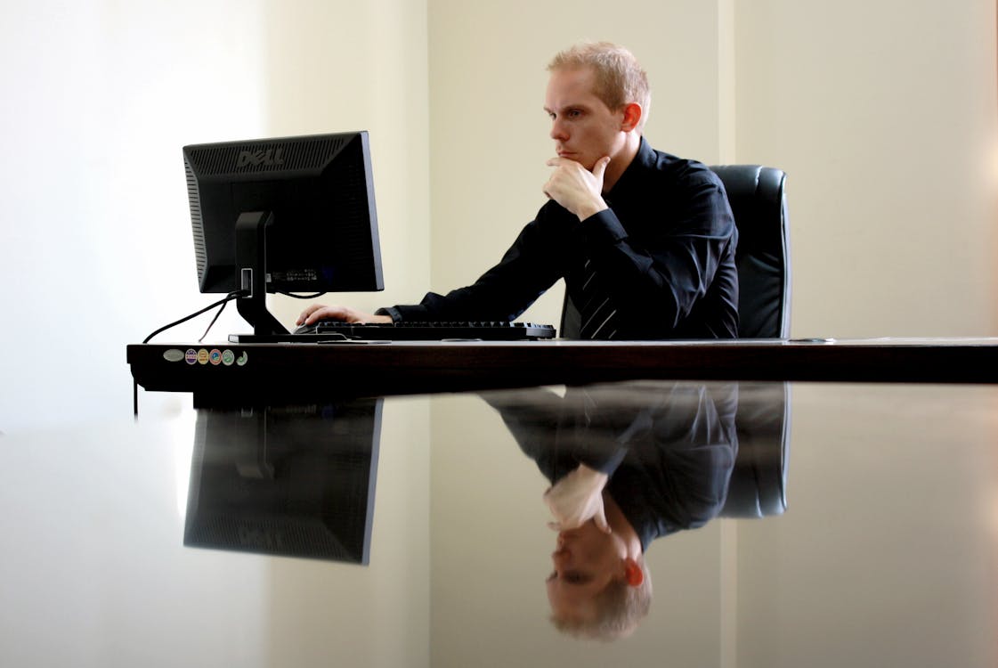 Man Sitting Facing Pc Inside Room