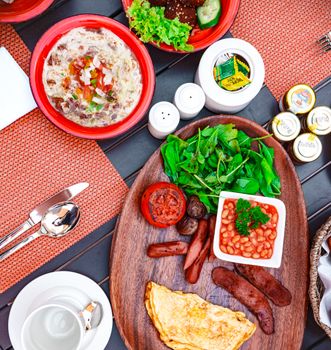 A vibrant top view of a traditional Bahraini breakfast showcasing diverse and colorful dishes.