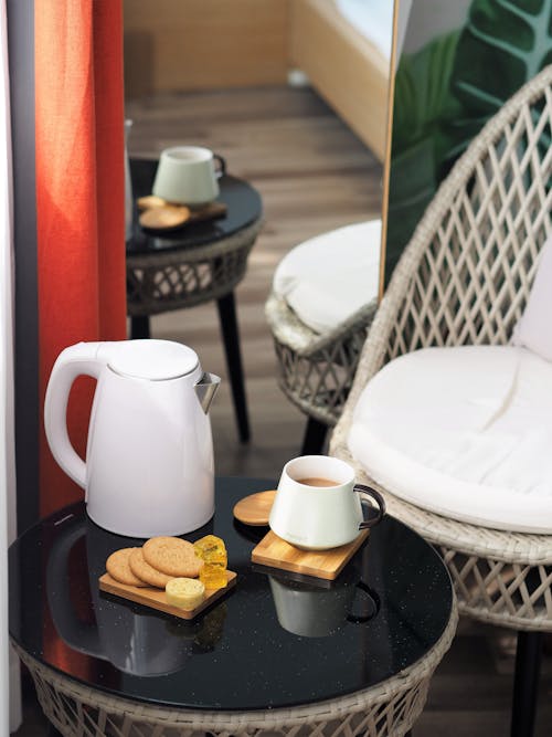 A Cup of Tea and Cookie on a Coffee Table