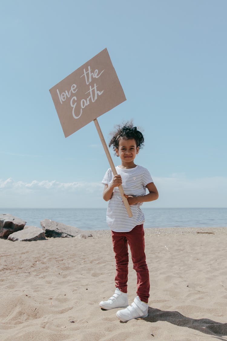 A Girl Holding A Poster