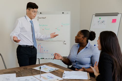 Man Having a Discussion with His Colleagues