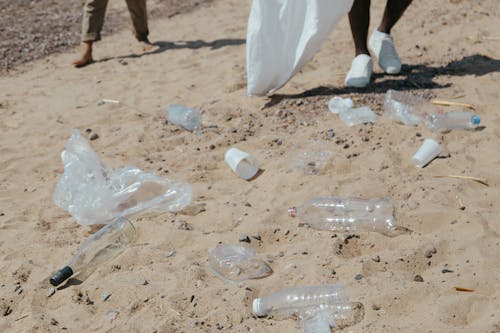 Plastic Bottles and Plastic Bags on Sand 