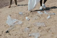 Clear Plastic Bottle on White Sand