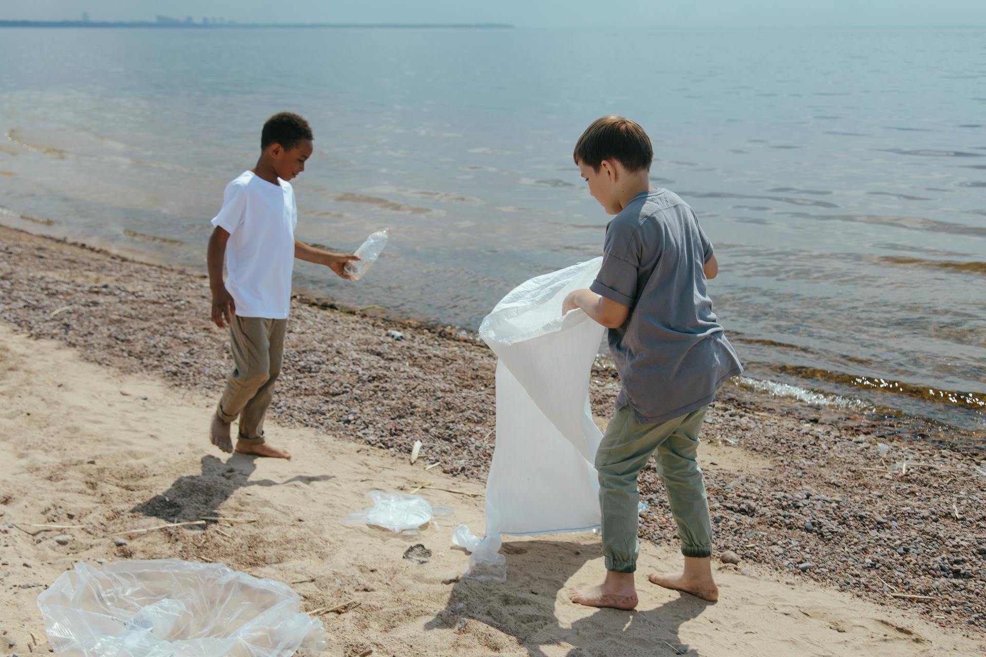 Boys Collecting Garbage at the Beach