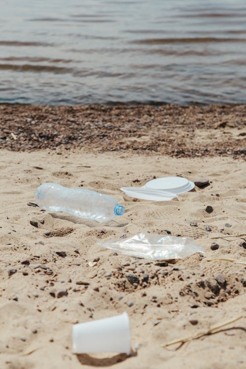 Clear Plastic Bottle on Brown Sand