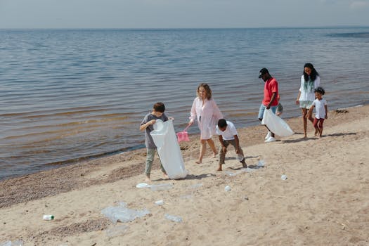 A diverse group of people engaging in beach clean-up, promoting environmental care.