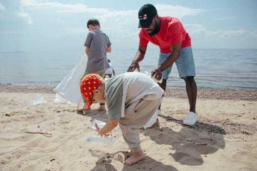 Group of volunteers cleaning a beach, emphasizing environmental conservation.