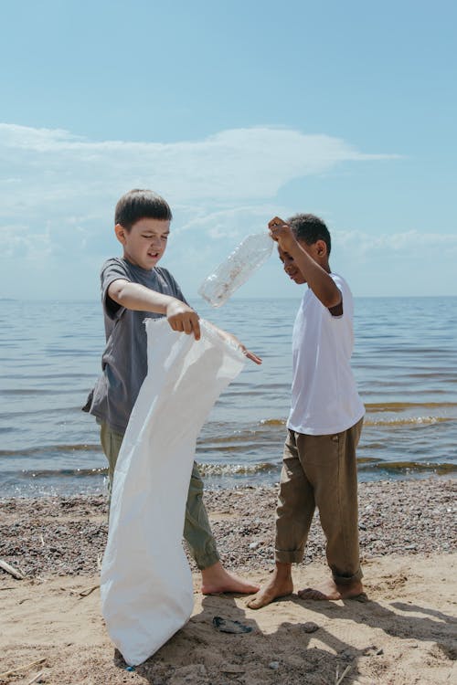 Free Boys Cleaning Beach Stock Photo