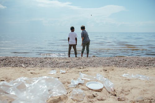 Boys on Beach Looking at Sea