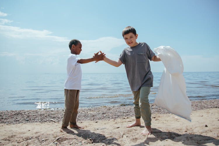 Kids Picking Trash On The Beach