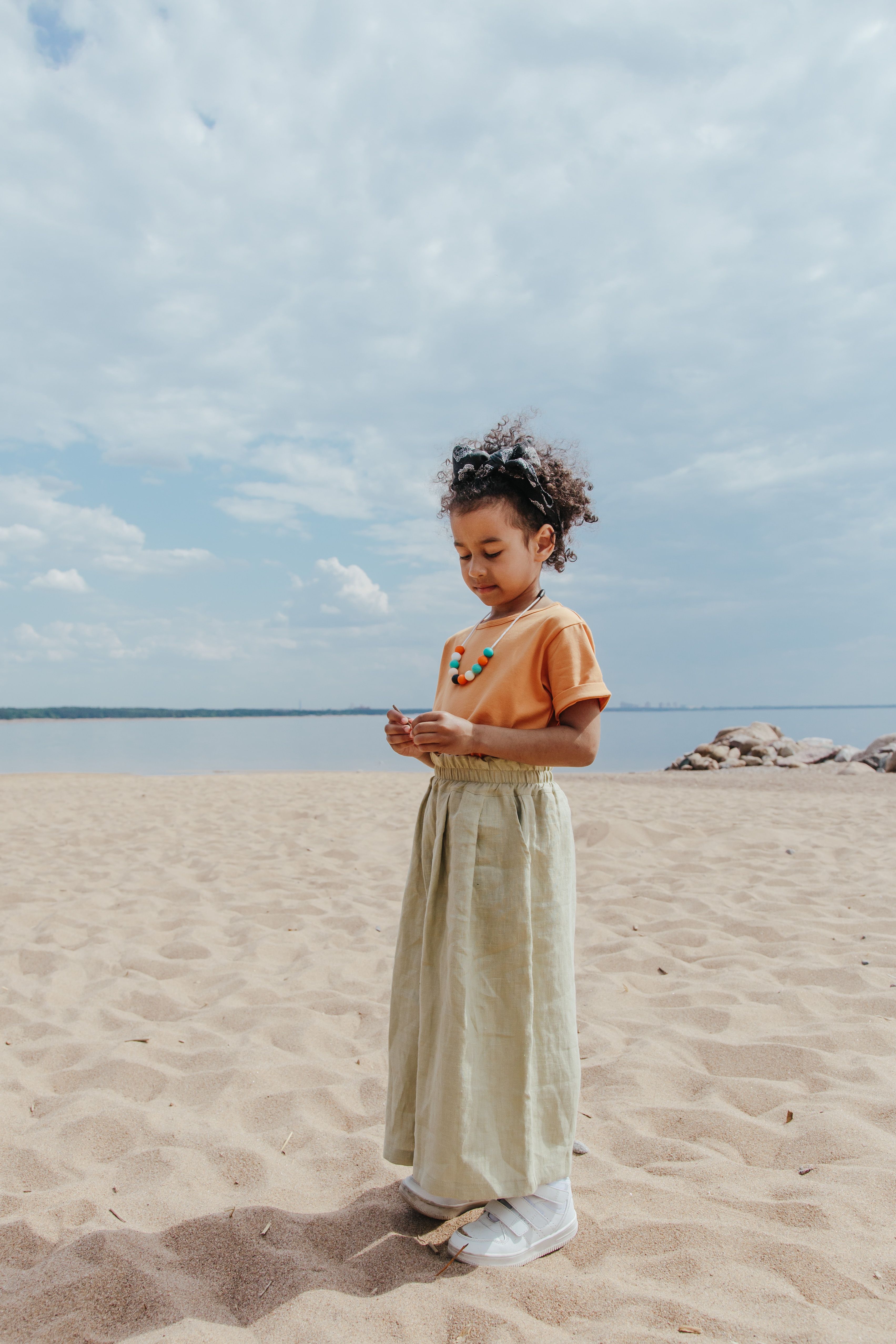 A Girl Standing on the Beach · Free Stock Photo