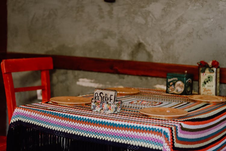 Restaurant Table With A Colourful Tablecloth 