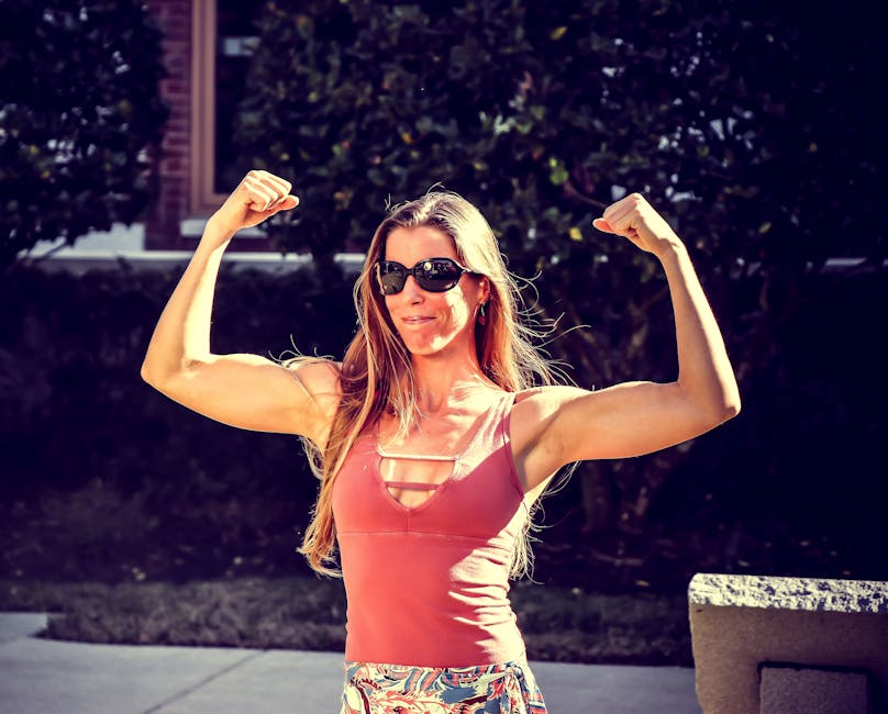 Lady with tone arm. Woman Showing Muscles