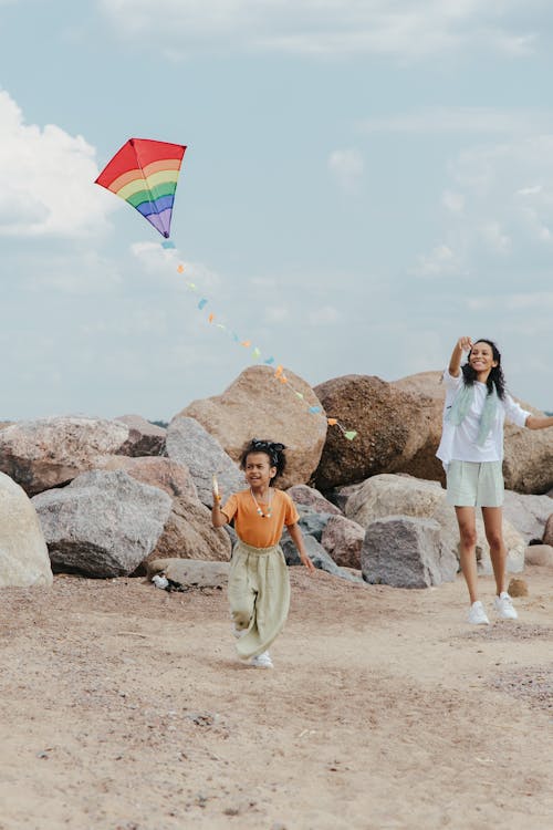 Free Woman and Child Playing Kite Stock Photo