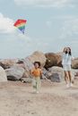 Woman and Child Playing Kite