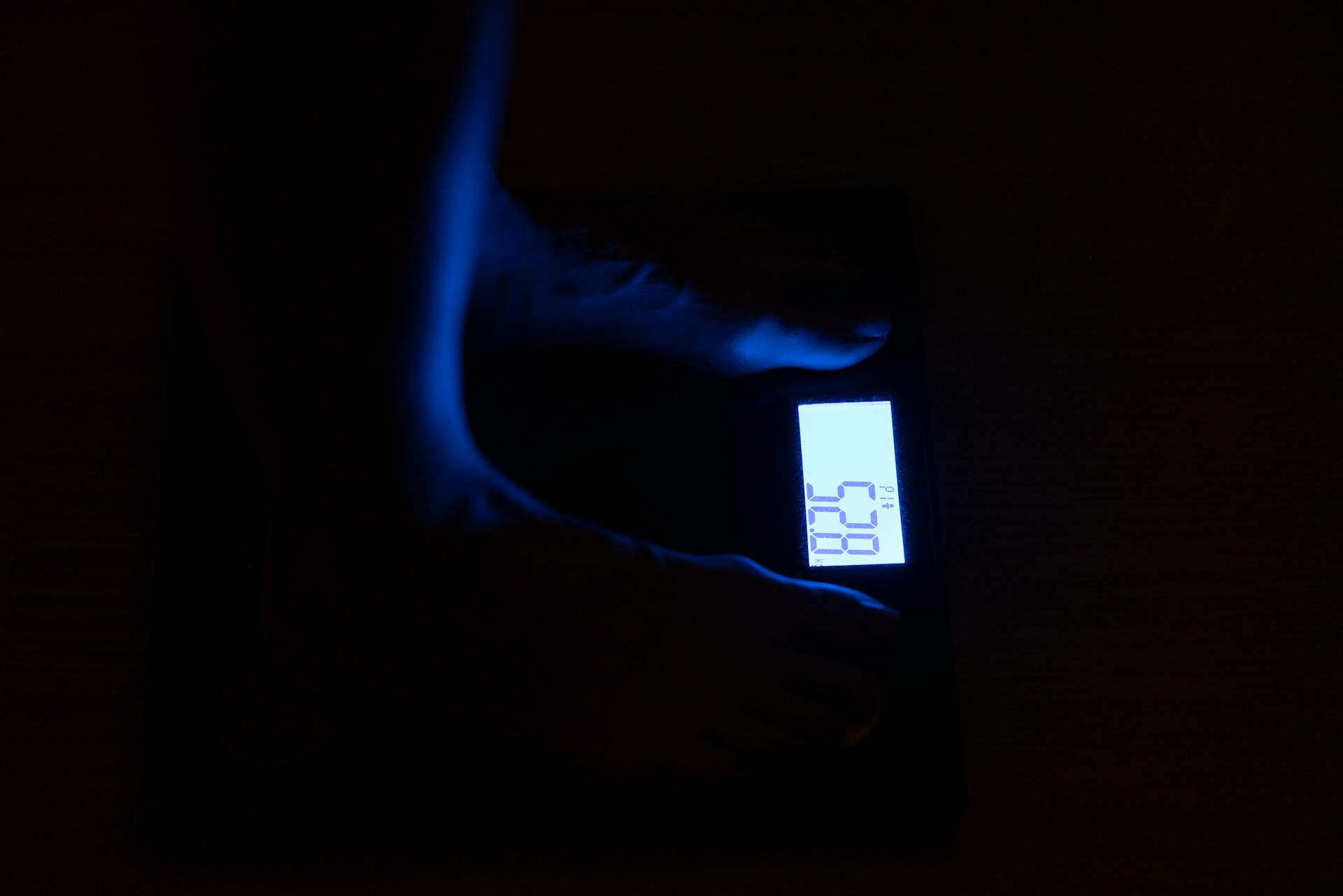 A Person Standing on Digital Weighing Scale