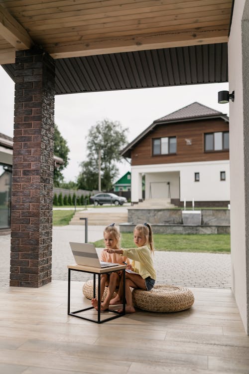 Two Girls Having an Online Class 