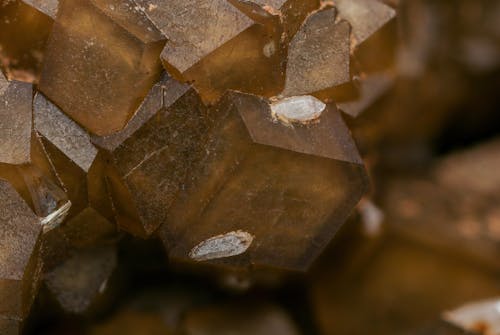 Close-Up Shot of a Brown Crystal