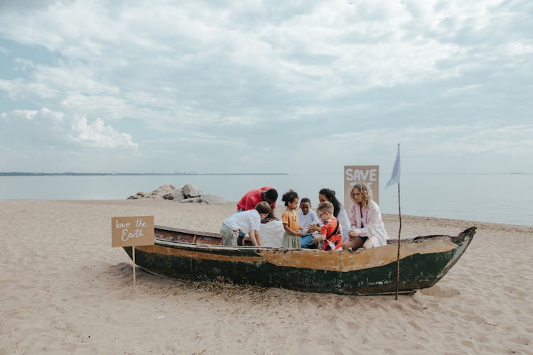 People Cleaning The Beach