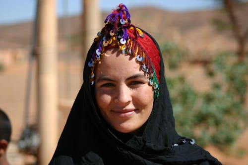 Close-Up Shot of a Woman in Black Hijab Smiling