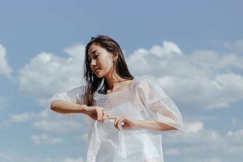 Brunette Woman Wearing Plastic Clothing