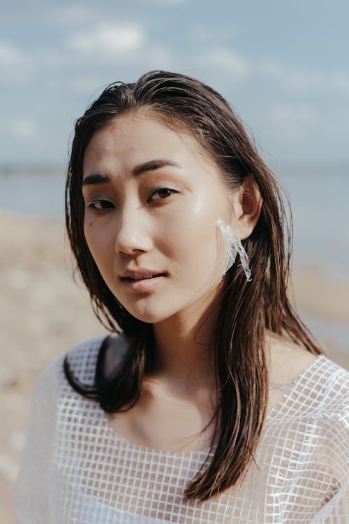 Close-Up Shot of a Pretty Woman in White Top