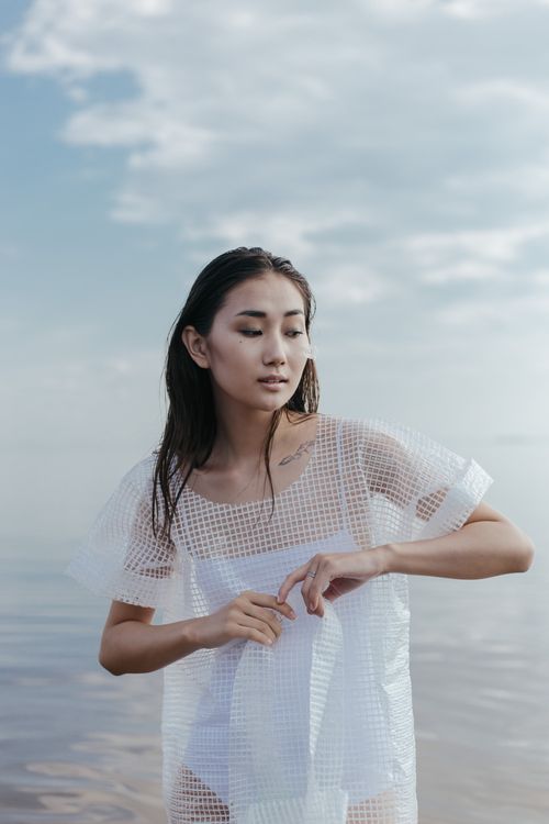 Woman in White Dress Standing on Beach · Free Stock Photo