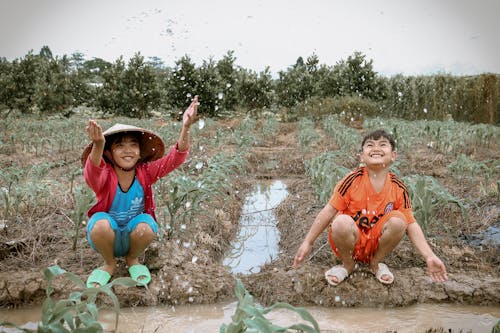 Kostenloses Stock Foto zu asiatin, asiatischer junge, feld