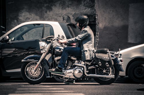 Man Riding a Black Touring Motorcycle