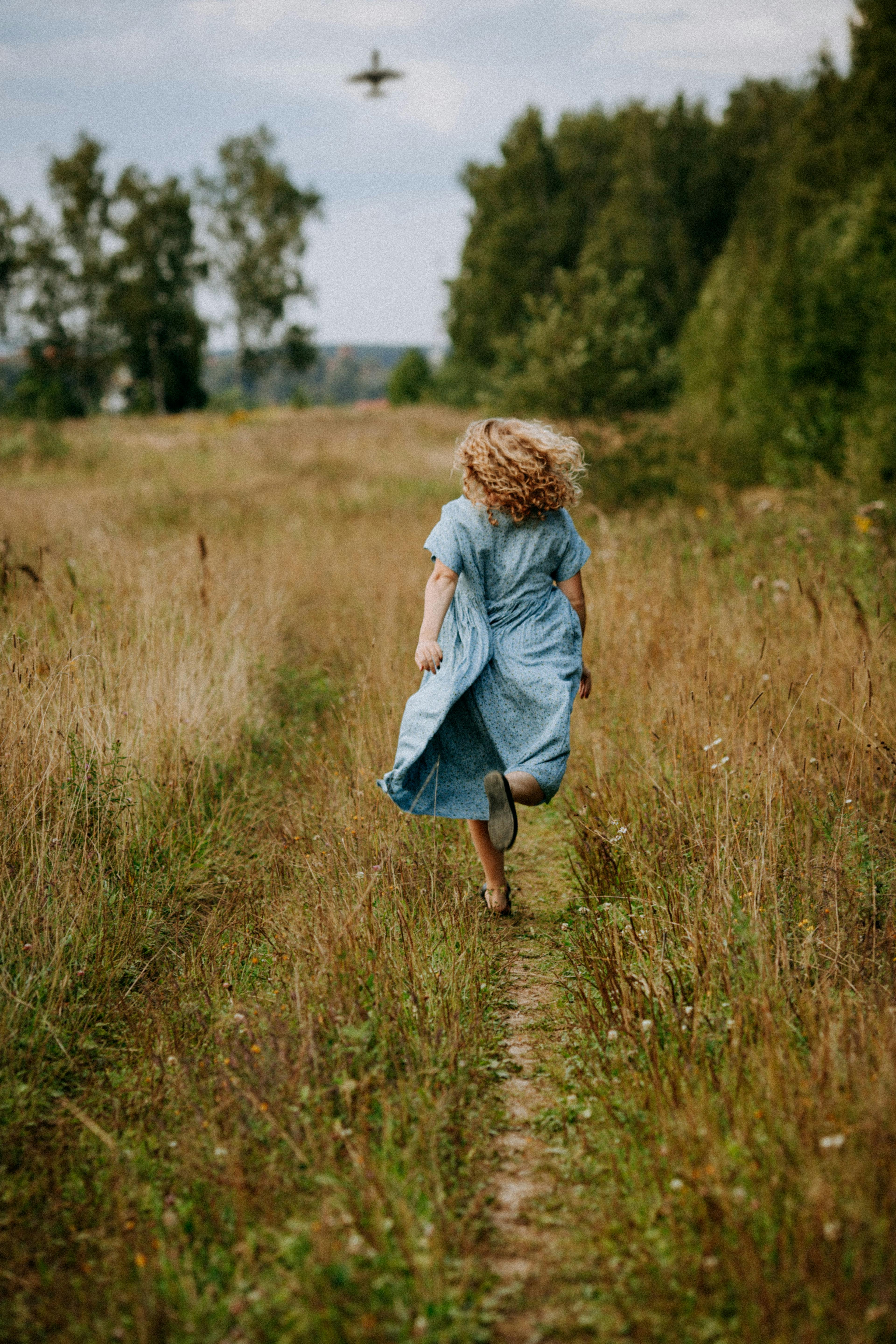 Beautiful girl in white dress running on the autumn field of wheat at  sunset time 3660071 Stock Photo at Vecteezy