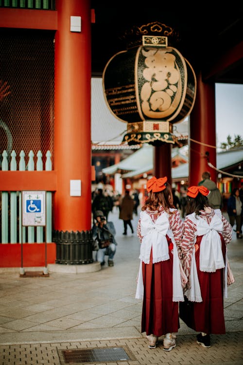Free People Wearing Costumes Entering a Temple Stock Photo