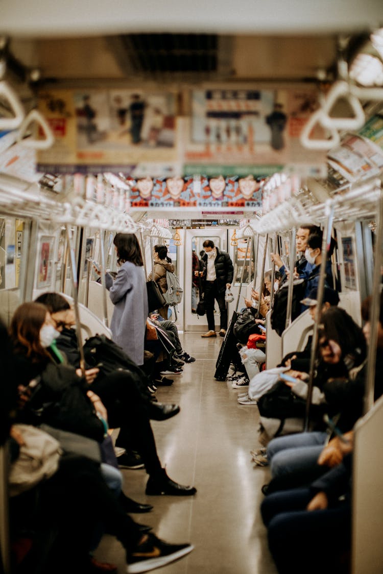 People Riding On A Train