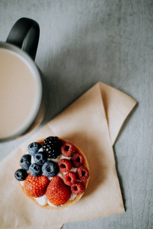 Close-Up Shot of a Dessert beside a Cup of Coffee