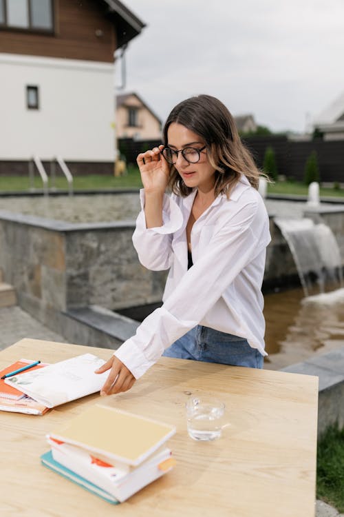 A Woman in White Long Sleeve Shirt